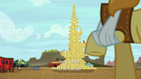 Braeburn looks at giant stack of hay bales S5E6