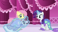 Rarity levitates period costume in front of Fluttershy S5E21