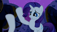 Sweetie Belle slapping Rarity's hoof away S2E05