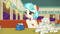 Coco Pommel with pile of used tissues S6E9