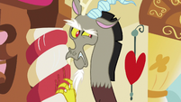 Discord scratching a decorative candy cane S5E7