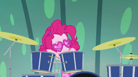 Pinkie rests her head on her drums EGSB