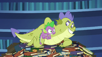 Sludge picks up Spike through book pile S8E24