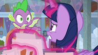 Twilight and Spike look worried at each other S9E3