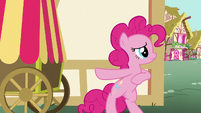 Pinkie Pie hides behind a house S5E19