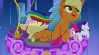 Rainbow carries Applejack out of the balloon MLPRR