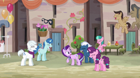 Starlight Glimmer surrounded by laughing villagers S6E25