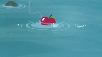 Apple bait being thrown onto the water S4E20