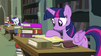 Twilight looking through library books S4E25