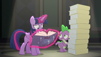 Twilight looking through the EEA guidebook S8E1