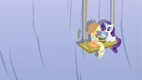 Rarity wiping off cement from Applejack's mane.