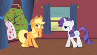 Rarity is not amused, while Applejack searches up for an excuse.