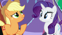 Applejack points at Rarity's paper lanterns S7E16