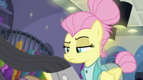 Fluttershy looking at jacket on the rack S8E4