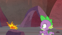 Spike dodges the tossed lava ball S9E9