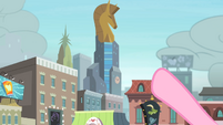 Pinkie Pie pointing at the clock with thunderclouds in the background S4E08