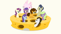 Ponies and a flying pig looking at Cheese angrily S4E12