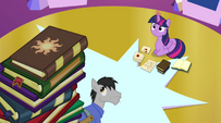 Book with Celestia's cutie mark on top of book pile EG2