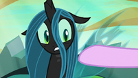 Queen Chrysalis looking at Starlight Glimmer's hoof S6E26