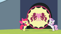 Apple Bloom and Sweetie Belle holding up the hoop S4E24