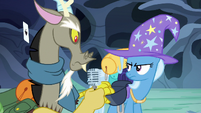 Discord takes a microphone out of Trixie's bag S6E25