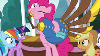 Pinkie plays music and bounces past ponies S8E18