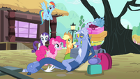 Discord lying on a pile of bags S4E11