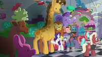 Rarity and Maud in front of giant stuffed giraffe S6E3