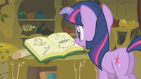 Twilight looking at Zecora's book S1E09