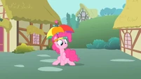 Pinkie Pie holding her twitchy tail.