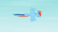 Rainbow Dash flying happily through the sky.