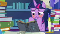 Twilight Sparkle pulling on her lower eyelids S7E25