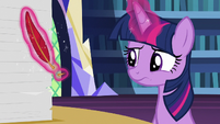 Twilight Sparkle looking at her broken quill S7E22