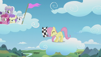 Filly Fluttershy waves the checkered flag S5E25