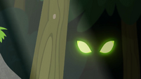 Sinister green eyes in the forest EG4