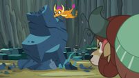 Smolder punching at the giant rock S9E3