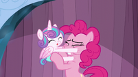 Pinkie tries to pull Flurry Heart away from her face S6E2