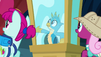 Gallus gestures toward museum exhibits S9E3