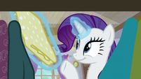 Rarity levitating a polka dot print S9E19