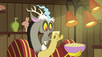 Discord reading a slip of paper S6E17