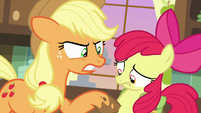 AJ prodding Apple Bloom with a muddy hoof S7E13