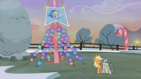 Applejack and Marble stand before the flag S5E20