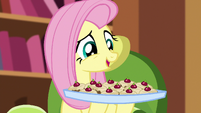 Fluttershy holds up a tray of teacakes S5E7