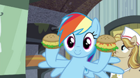 Rainbow holding up oat burgers S4E22