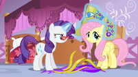 Rarity levitating headdress pieces onto Fluttershy S4E19