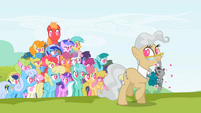 Near the top of the pony pile, above Scootaloo.