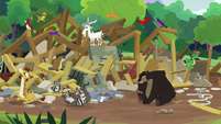 Animals in a pile of wood and stone rubble S7E5
