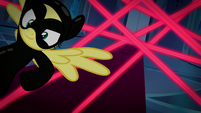 Fluttershy leaps past the lasers S9E4