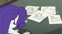 Sketches and diamonds in front of Rarity EGDS27