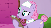 Spa Pony looking at clipboard S6E10